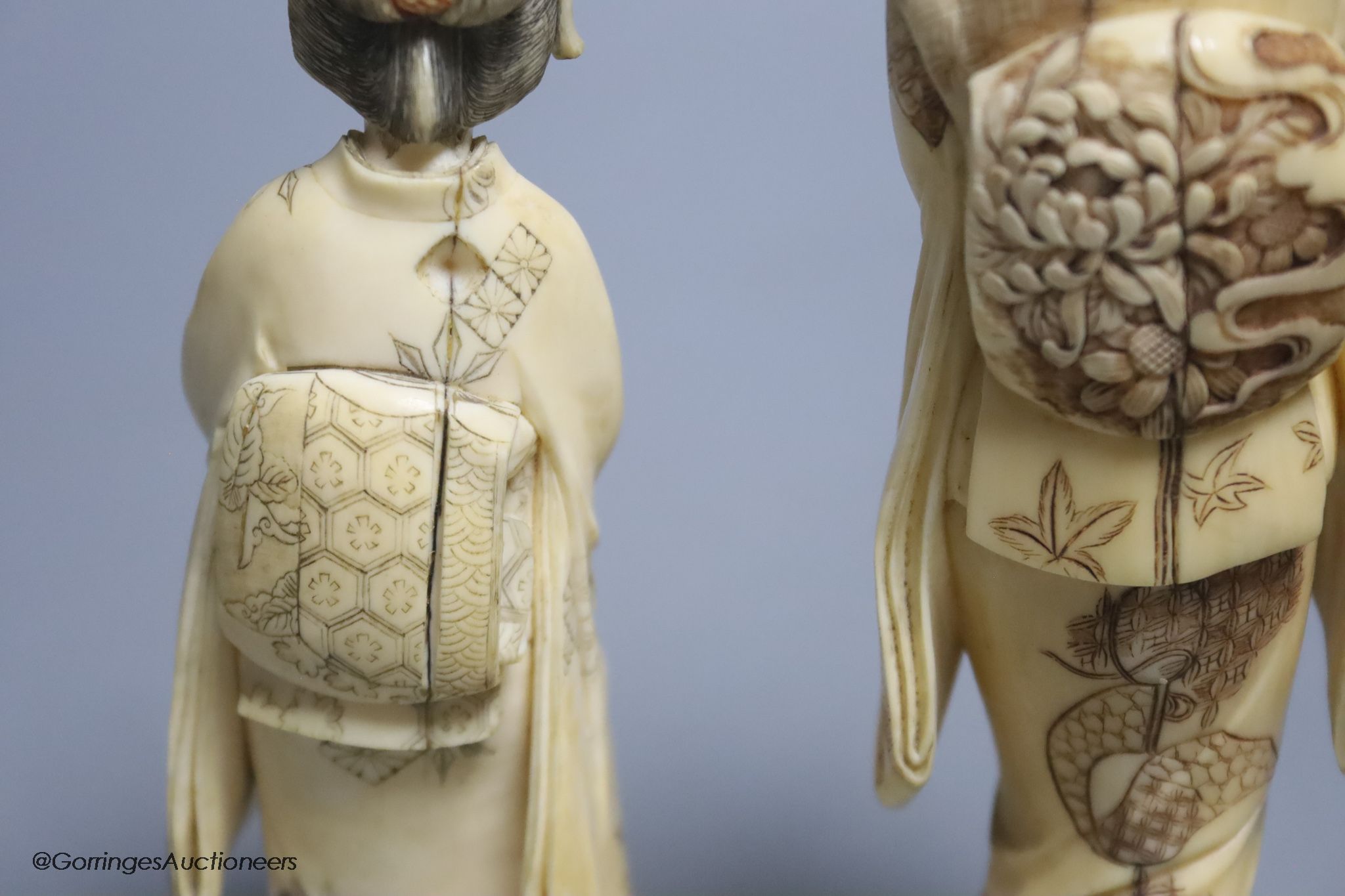 Two Japanese ivory figures of bijin, early 20th century, one signed to the base, height 17.5cm